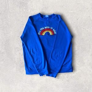 Hanna Andersson’s Embroidered “All You Need Is Love” Crewneck